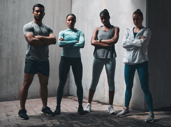 Team standing with arms crossed